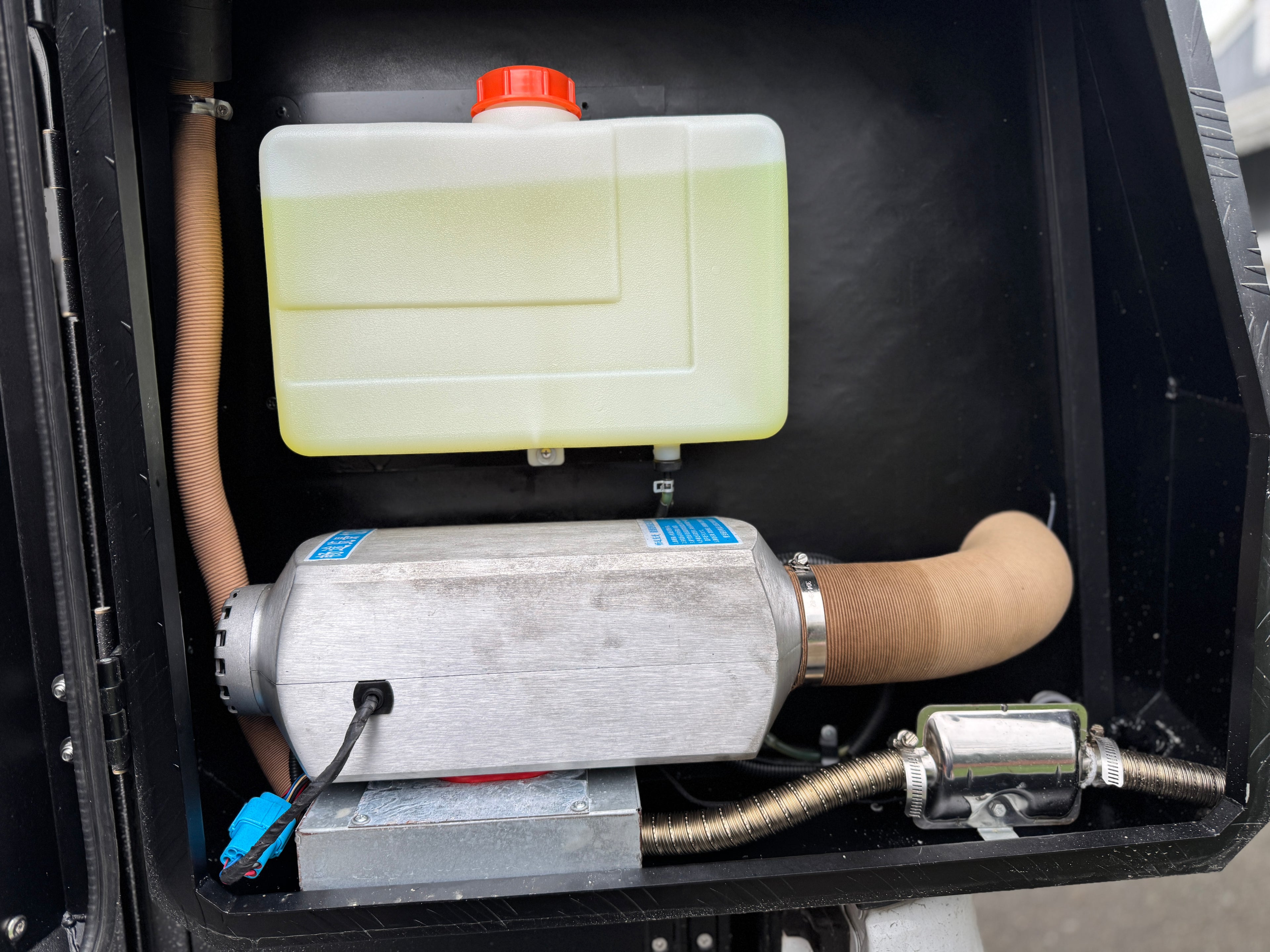 Diesel heater inside rear storage compartment