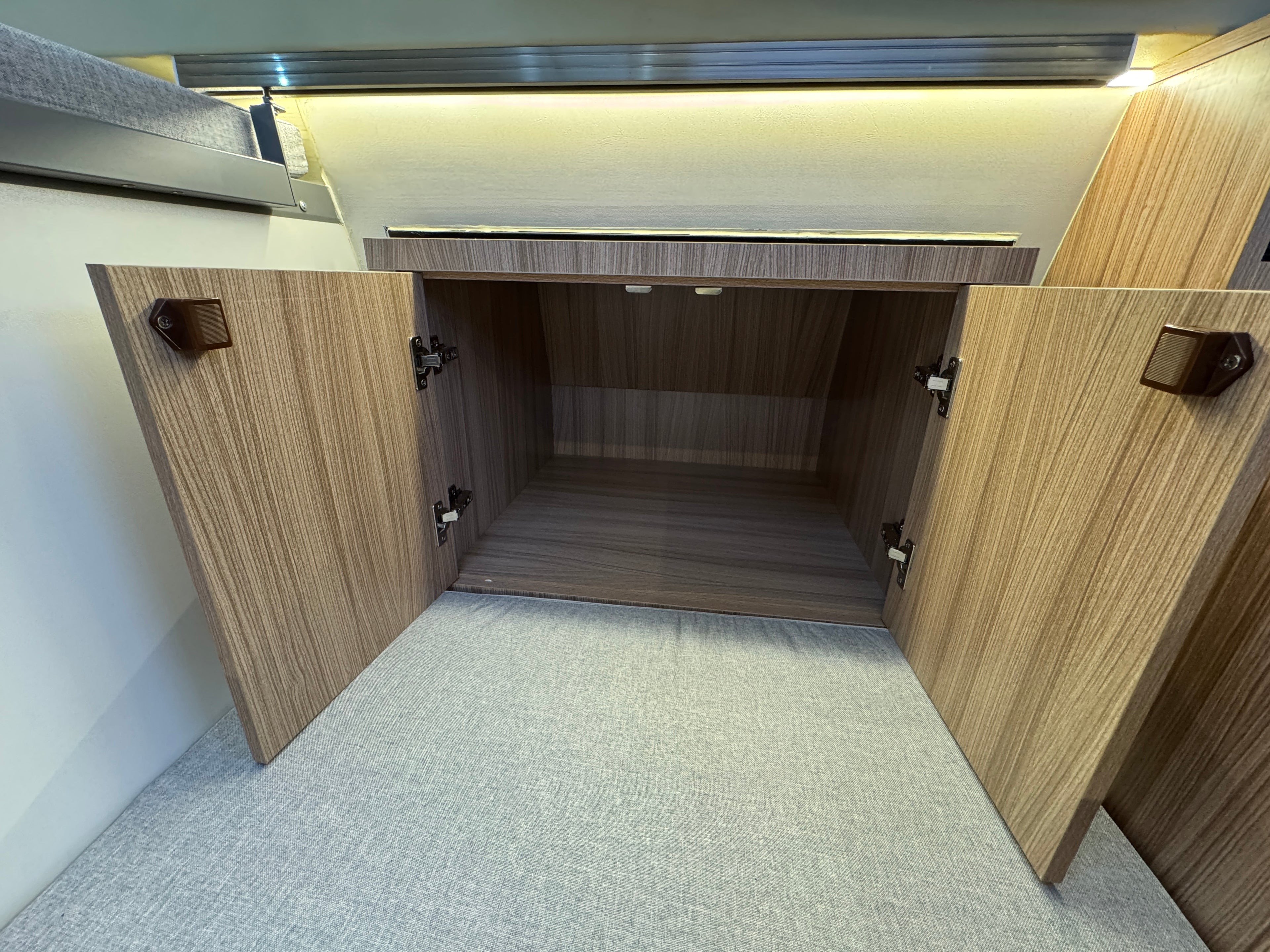 Wooden cabinets with open doors in a compact space
